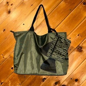 Under Armour army green and black shoulder bag with side pouch